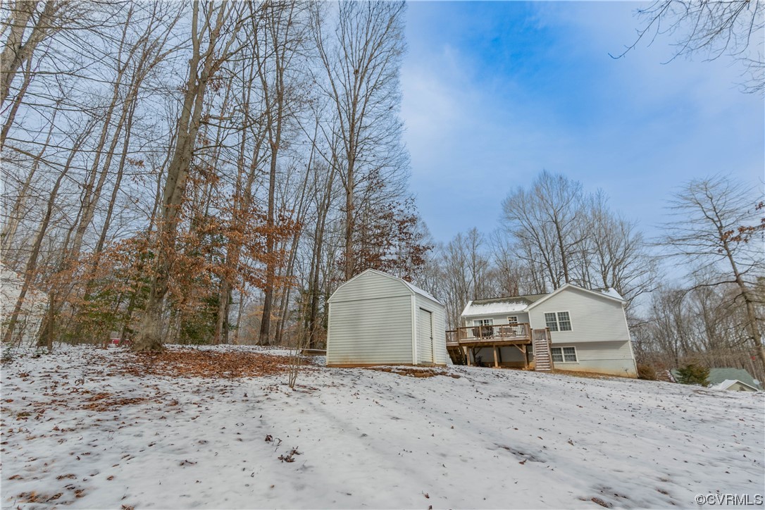 213 Cedar Ridge Drive Ruther Glen, VA 22546 - Photo 40 of 50 a front view of a house with a yard and covered with snow
