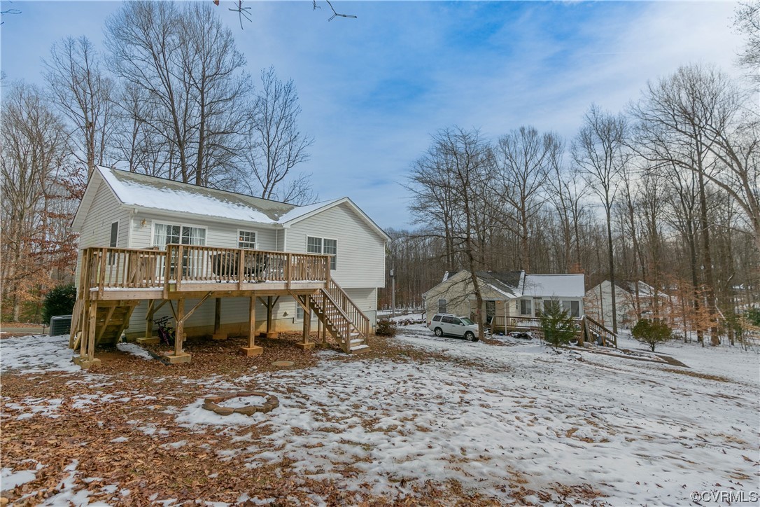 213 Cedar Ridge Drive Ruther Glen, VA 22546 - Photo 4 of 50 Snow covered rear of property featuring a deck