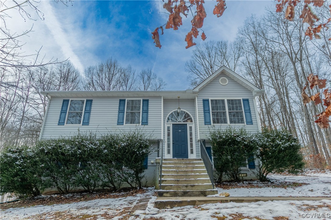 213 Cedar Ridge Drive Ruther Glen, VA 22546 - Photo 42 of 50 a front view of a house with garden