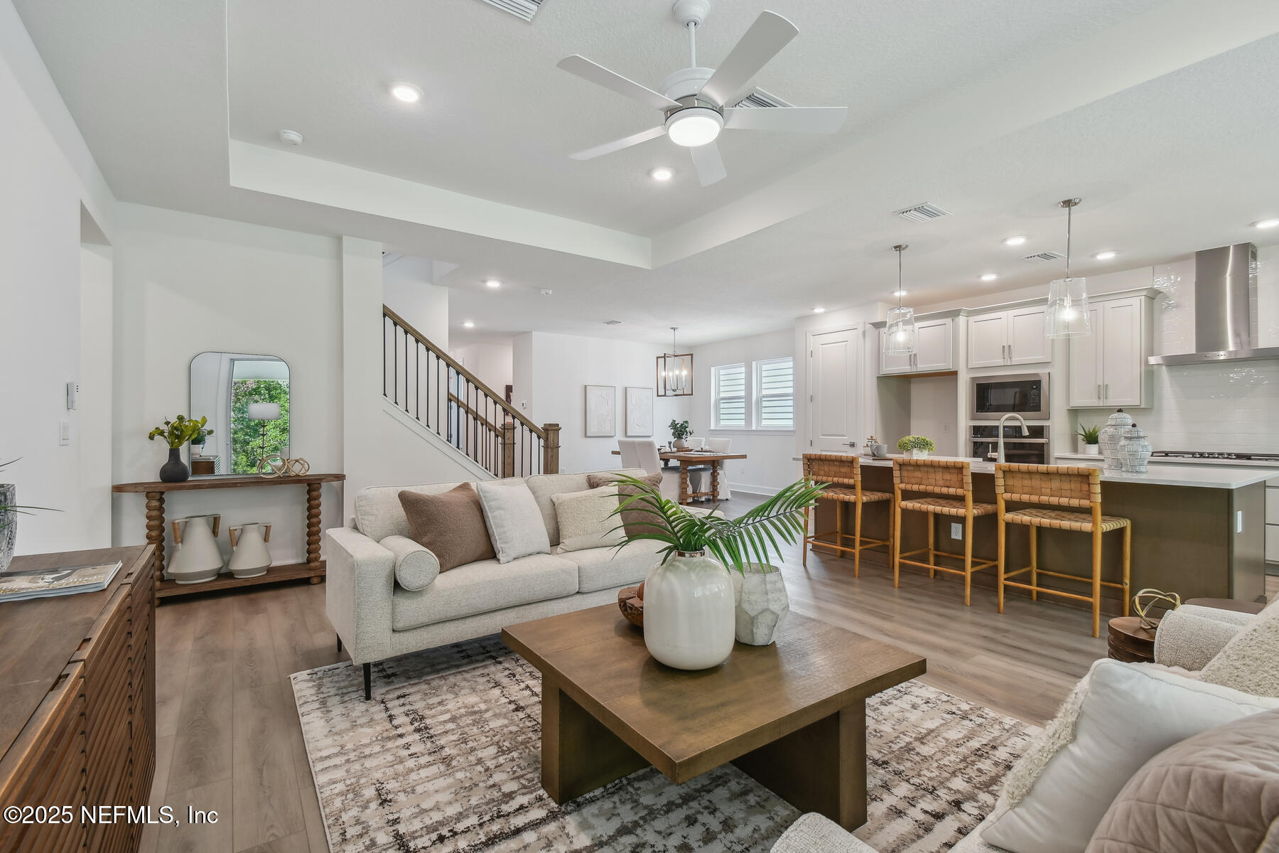 211 Rushing Drive St. Augustine, FL 32092 - Photo 12 of 25 a living room with furniture kitchen view and a dining table
