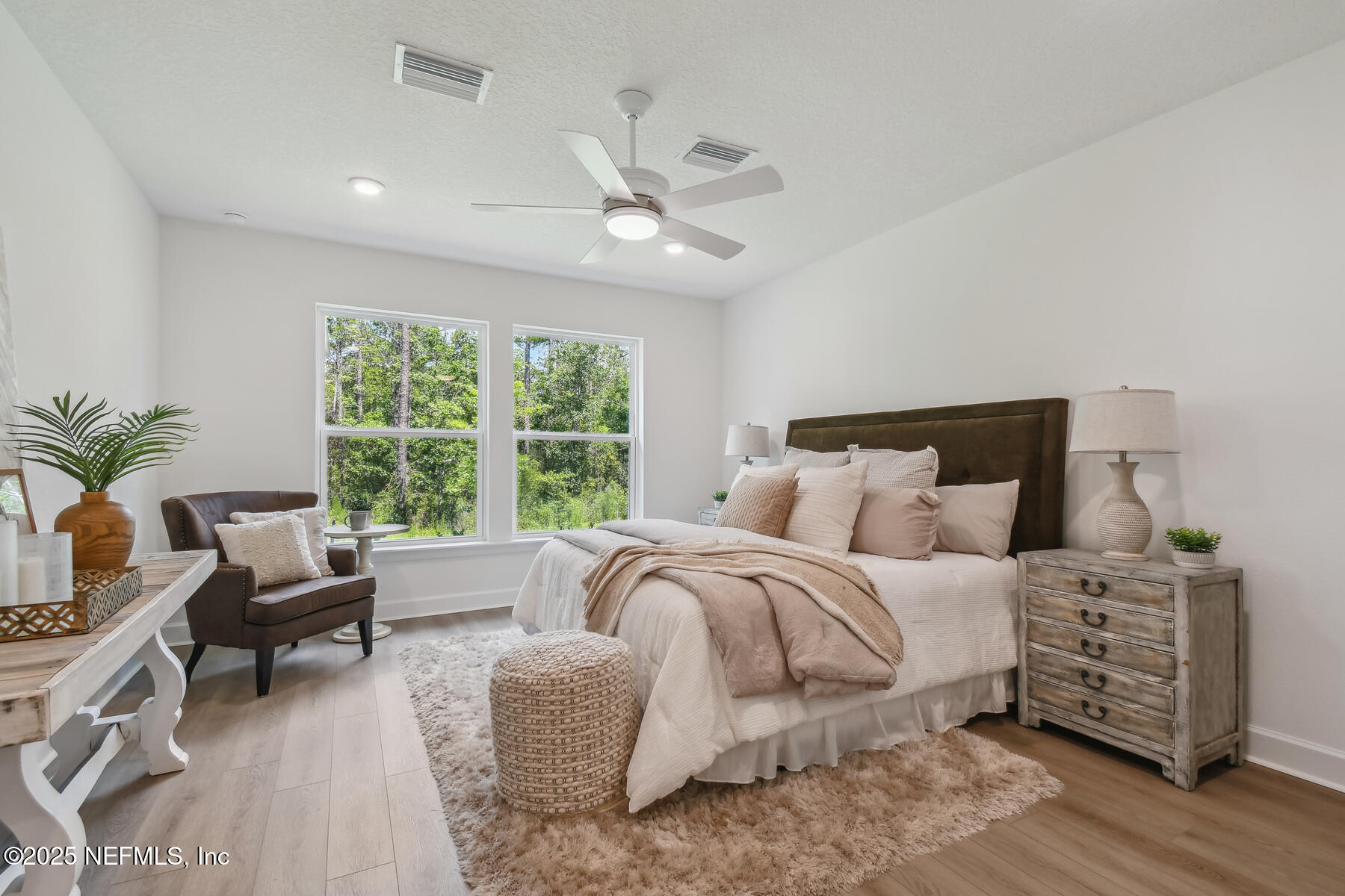 211 Rushing Drive St. Augustine, FL 32092 - Photo 13 of 25 a bedroom with bed and a large window