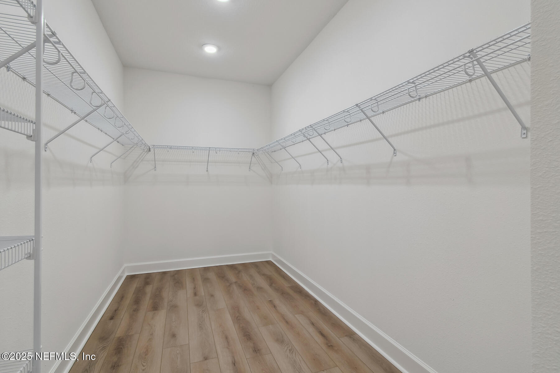 211 Rushing Drive St. Augustine, FL 32092 - Photo 19 of 25 a view of a room with racks on the wall