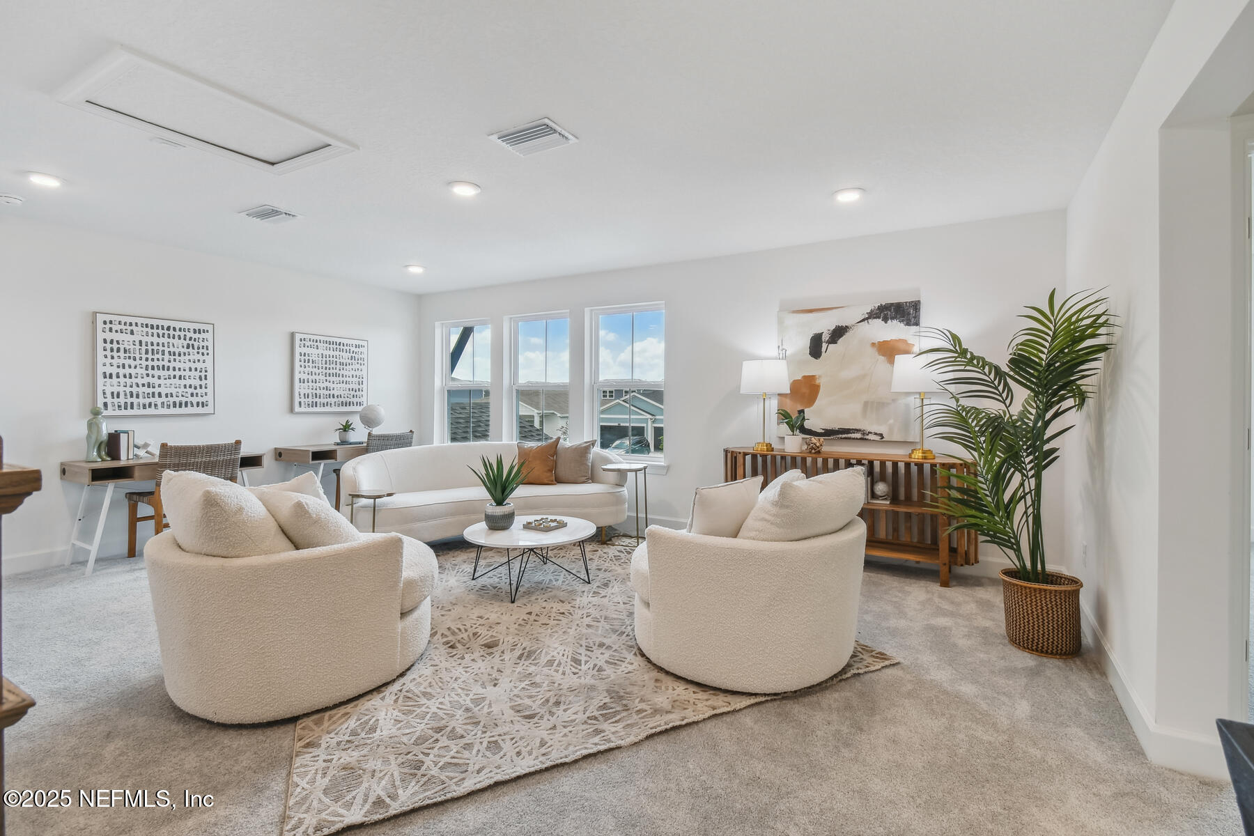 211 Rushing Drive St. Augustine, FL 32092 - Photo 20 of 25 a living room with furniture and a potted plant