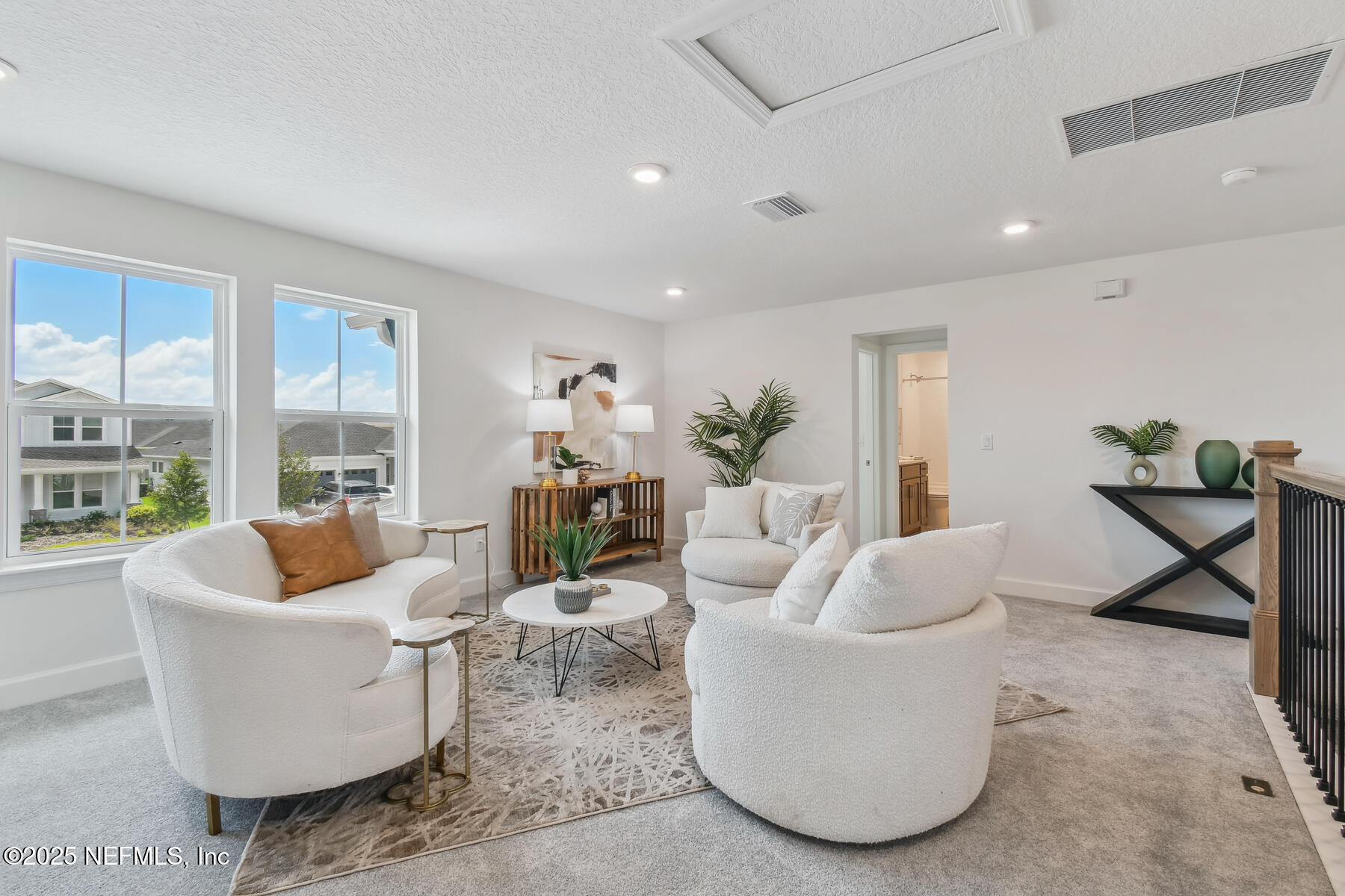 211 Rushing Drive St. Augustine, FL 32092 - Photo 22 of 25 a living room with furniture and a potted plant
