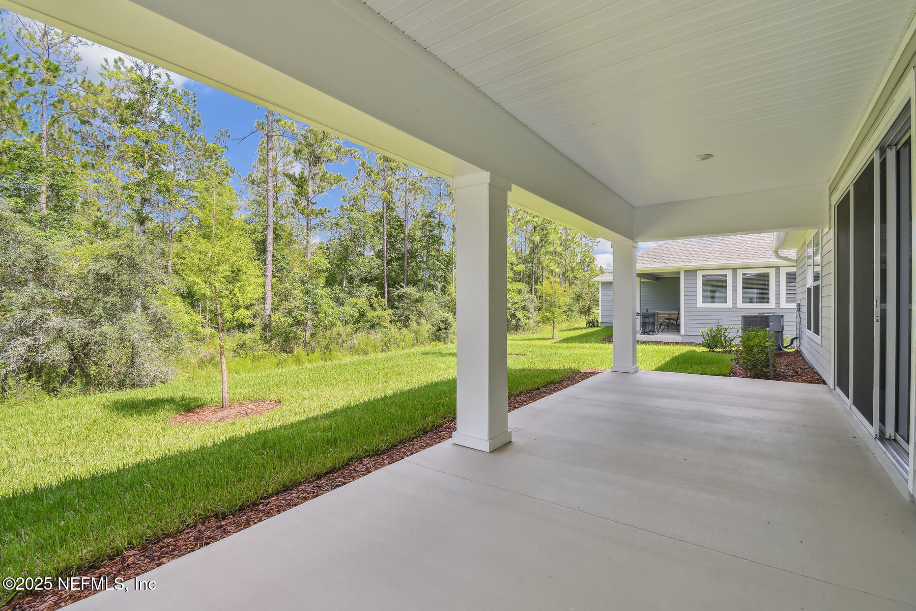 211 Rushing Drive St. Augustine, FL 32092 - Photo 23 of 25 a view of a house with backyard and porch