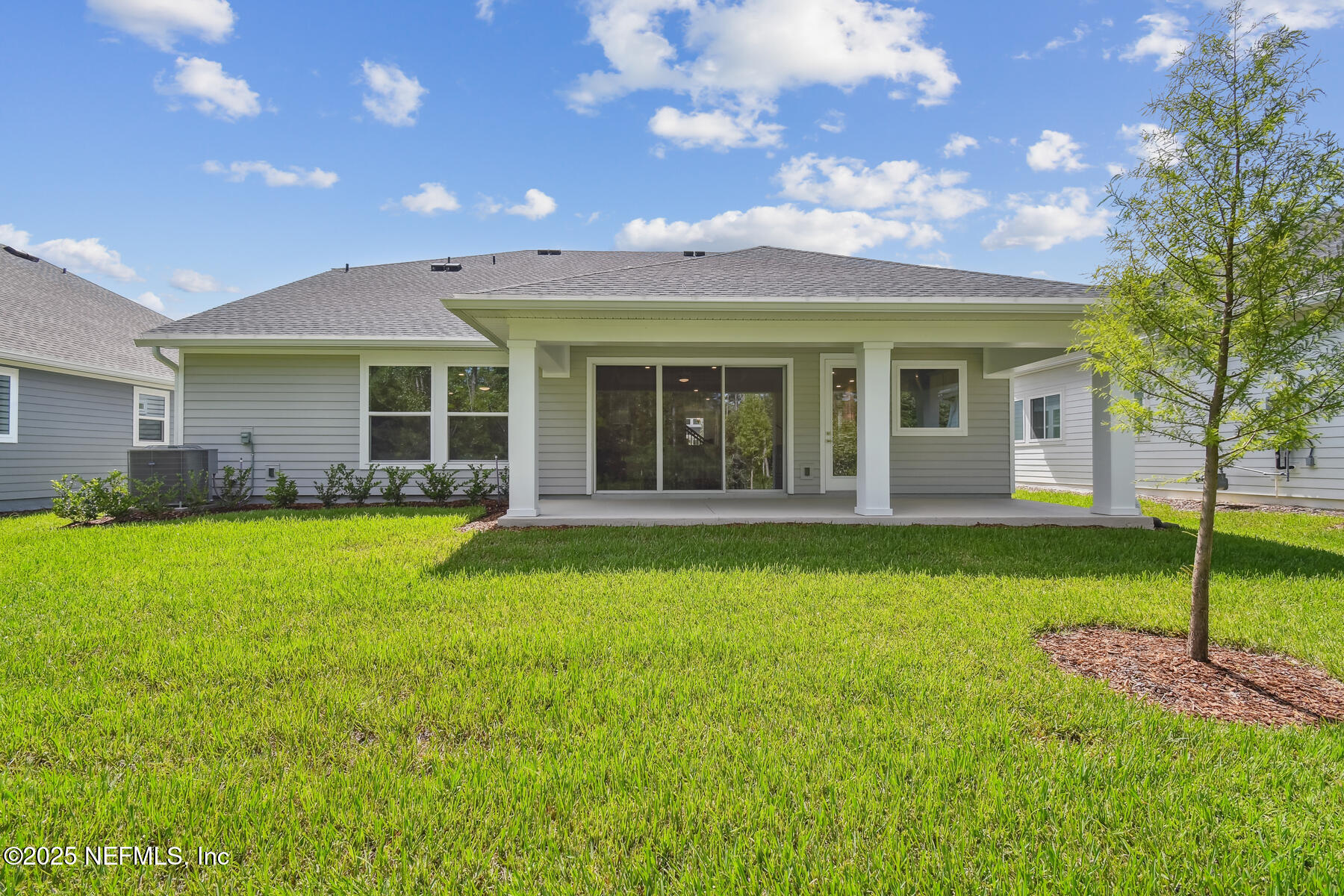 211 Rushing Drive St. Augustine, FL 32092 - Photo 25 of 25 a view of a house with a garden