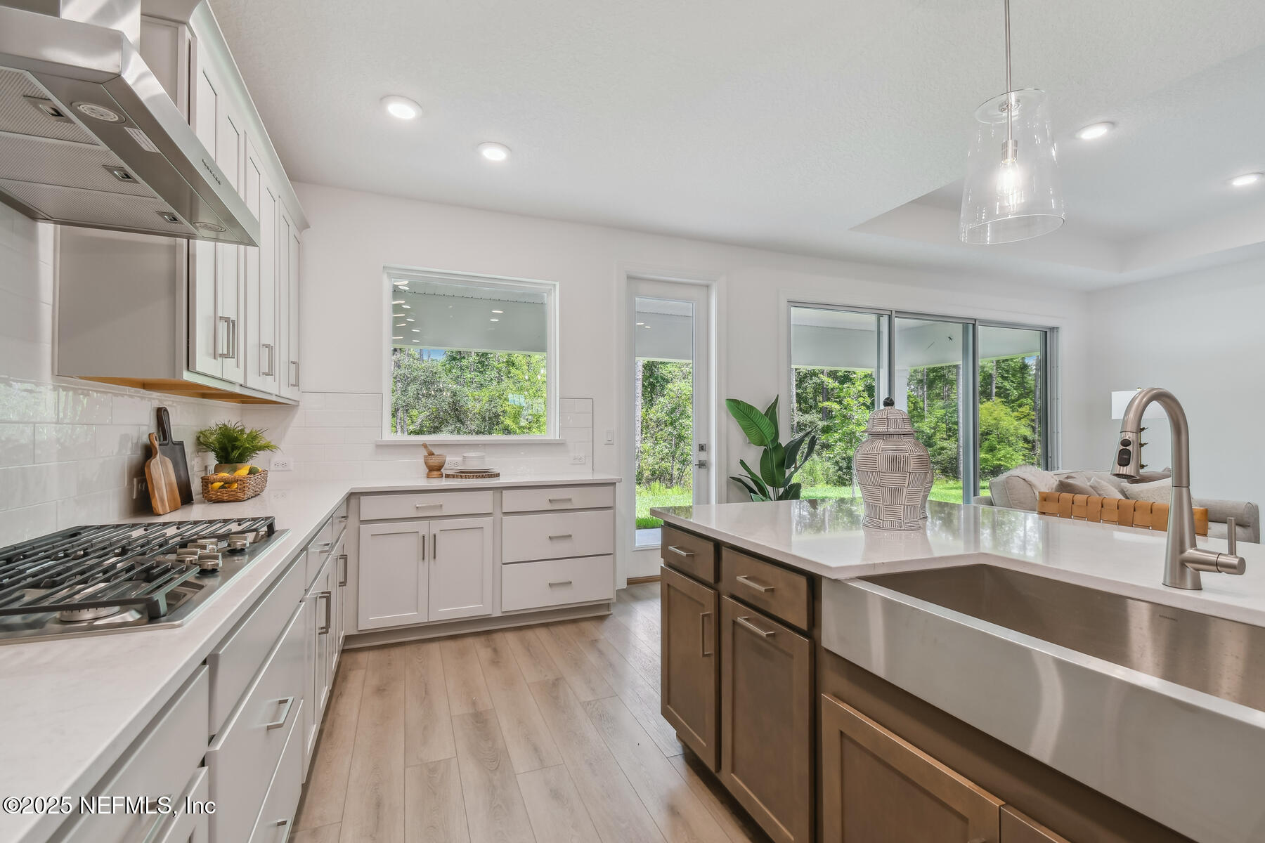 211 Rushing Drive St. Augustine, FL 32092 - Photo 3 of 25 a kitchen with a sink stove and window