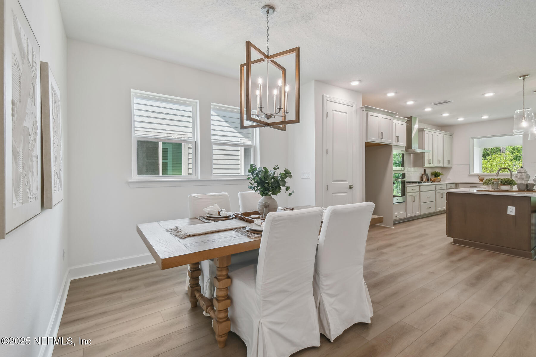 211 Rushing Drive St. Augustine, FL 32092 - Photo 7 of 25 a view of a dining room with furniture window and wooden floor