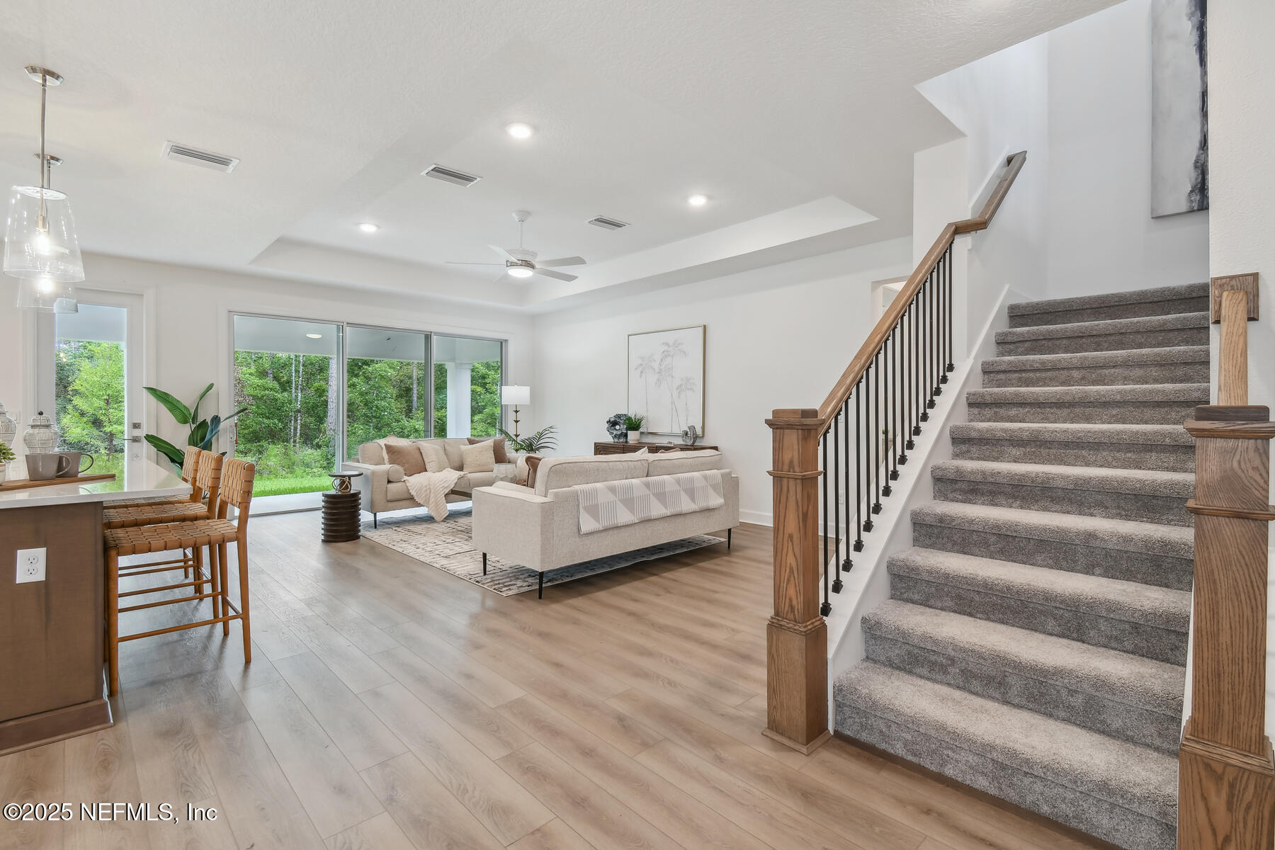 211 Rushing Drive St. Augustine, FL 32092 - Photo 10 of 25 a living room with furniture and a wooden floor