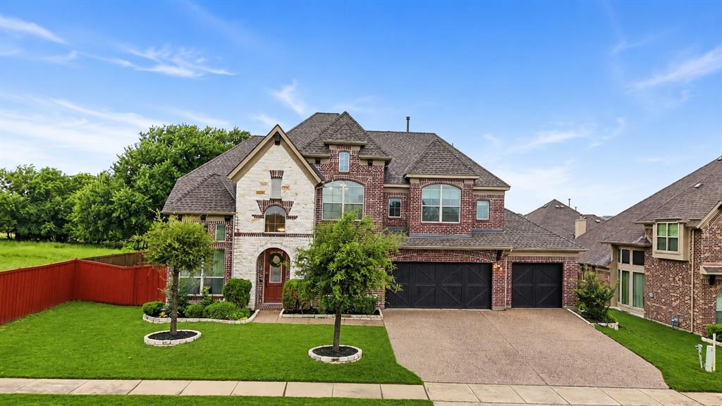 624 Sorrell Road McKinney, TX 75072 - Photo 1 of 28 a front view of a house with garden