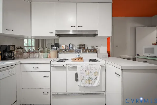 a kitchen with stainless steel appliances granite countertop a sink and cabinets