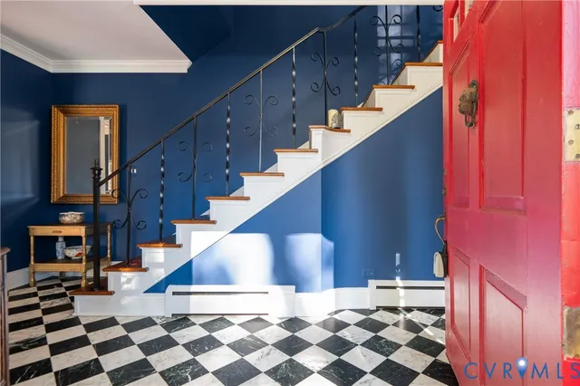 a view of entryway and hall with wooden floor