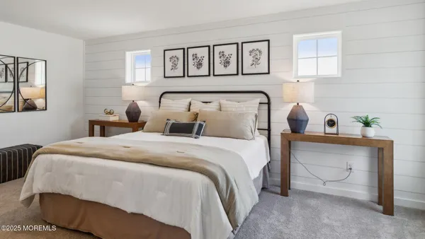 a bedroom with bed and window