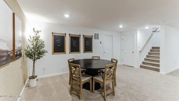 a living room with furniture and a table
