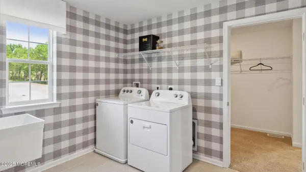 a bedroom with a bed and cabinets