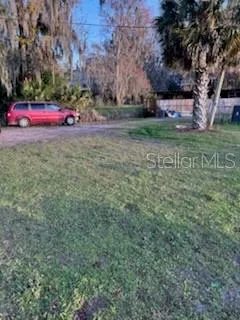 a view of street with parked cars