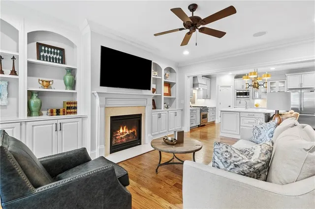 a living room with furniture fireplace and flat screen tv