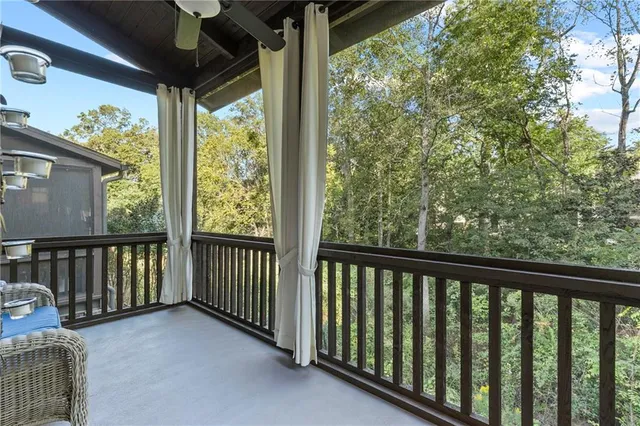 a view of balcony with wooden floor