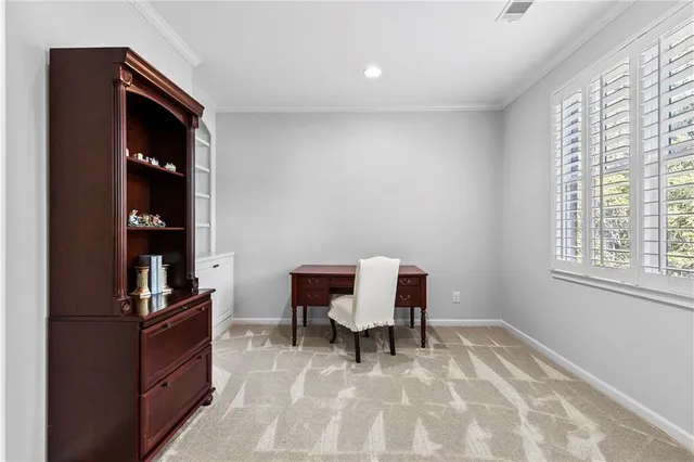 a workspace with furniture and window