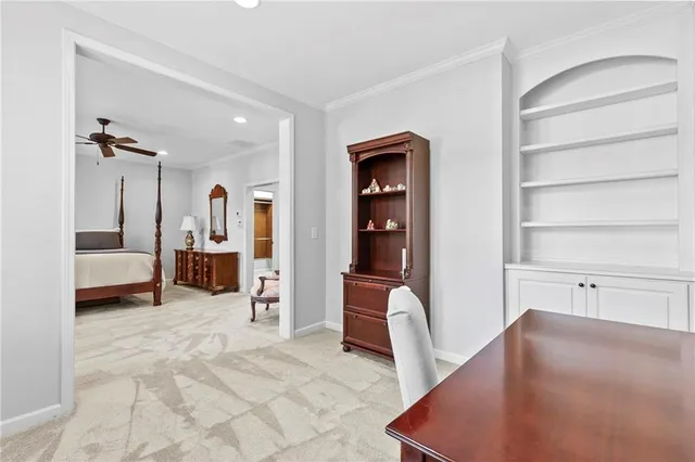 a view of a bedroom with a furniture and closet