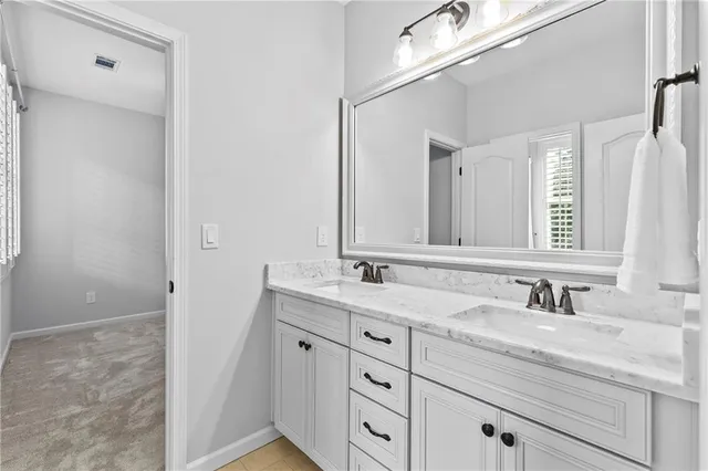 a white toilet sitting next to a bathroom sink