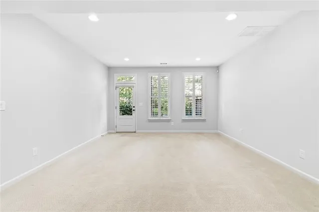 a bedroom with bed and window