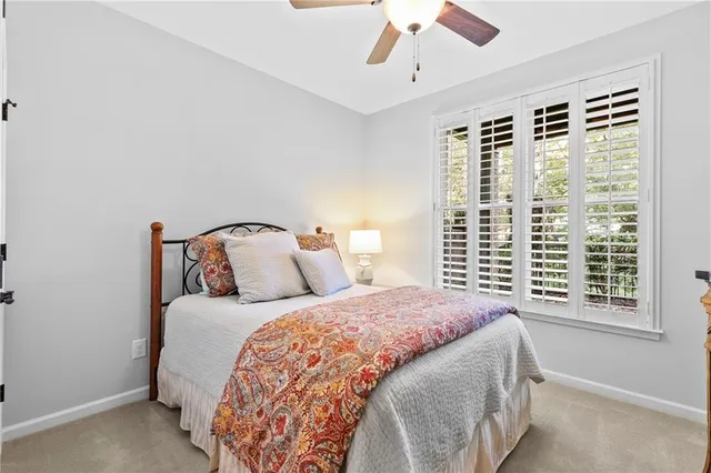a white toilet sitting next to a bathroom sink