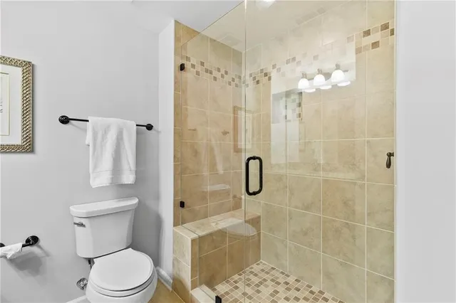 a porch with a table and chairs and potted plants