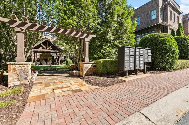 a view of a backyard with large trees