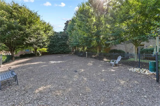 an aerial view of a house with a yard and lake view