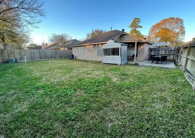 a front view of a house with yard porch and furniture