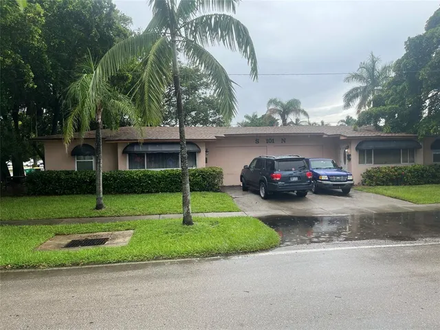 a view of a car parked in front of a house