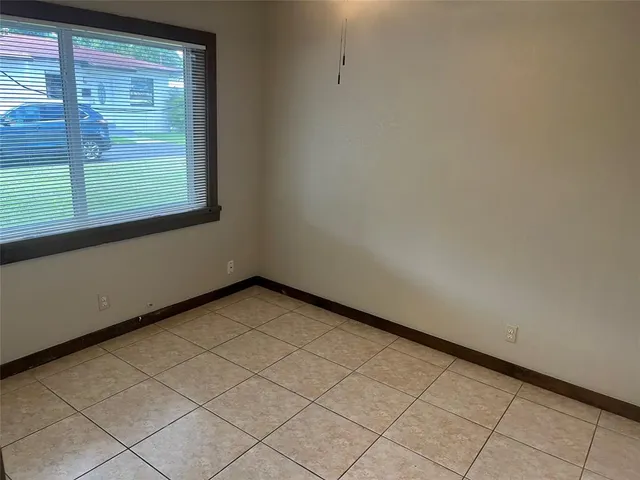 a view of a room with a large window