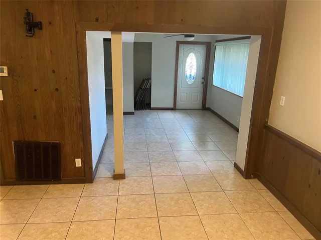 a view of a hallway with seating area