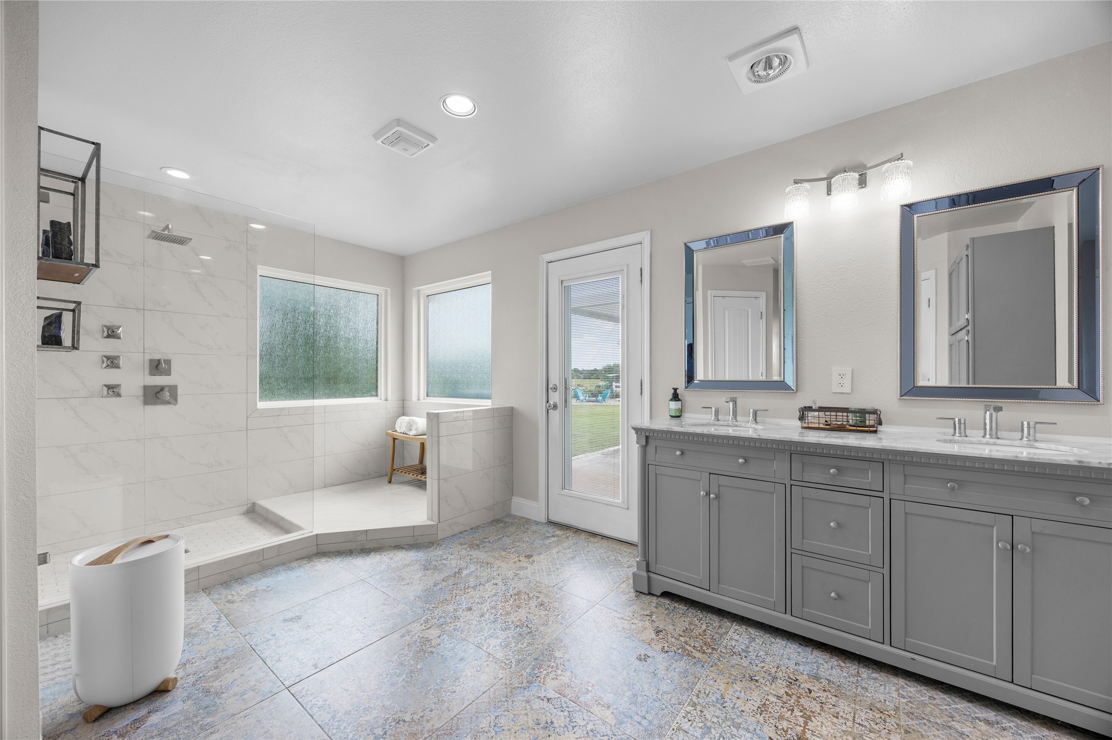 1283 Rattlesnake Trail Burnet, TX 78611 - Photo 24 of 39 a spacious bathroom with a double vanity sink a mirror and a bathtub