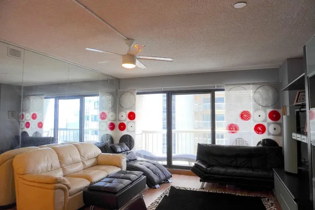 a living room with furniture and a large window