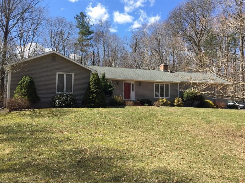 399 Warpas Road Madison, CT 06443 - Photo 1 of 1 a front view of a house with a yard