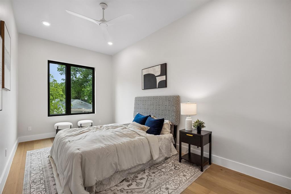 4615 Rusk Avenue Dallas, TX 75204 - Photo 22 of 25 a bedroom with a bed and a window