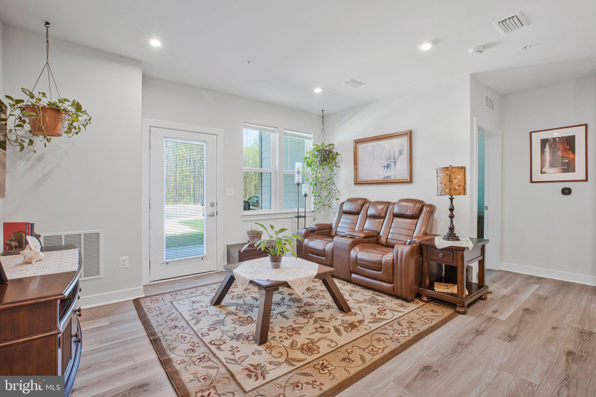 10401 Resort Road, Unit F Ellicott City, MD 21042 - Photo 3 of 13 a living room with furniture and a rug