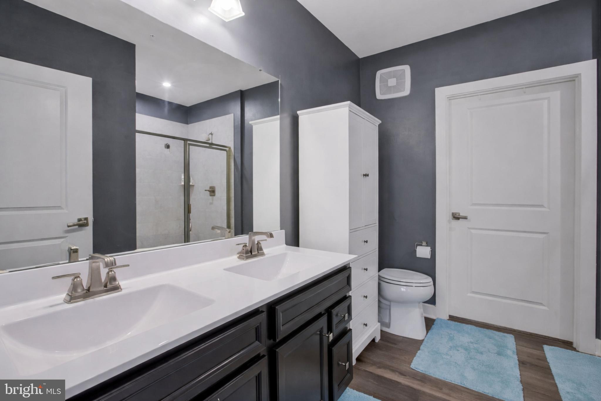 10401 Resort Road, Unit F Ellicott City, MD 21042 - Photo 8 of 13 a bathroom with a sink and a mirror