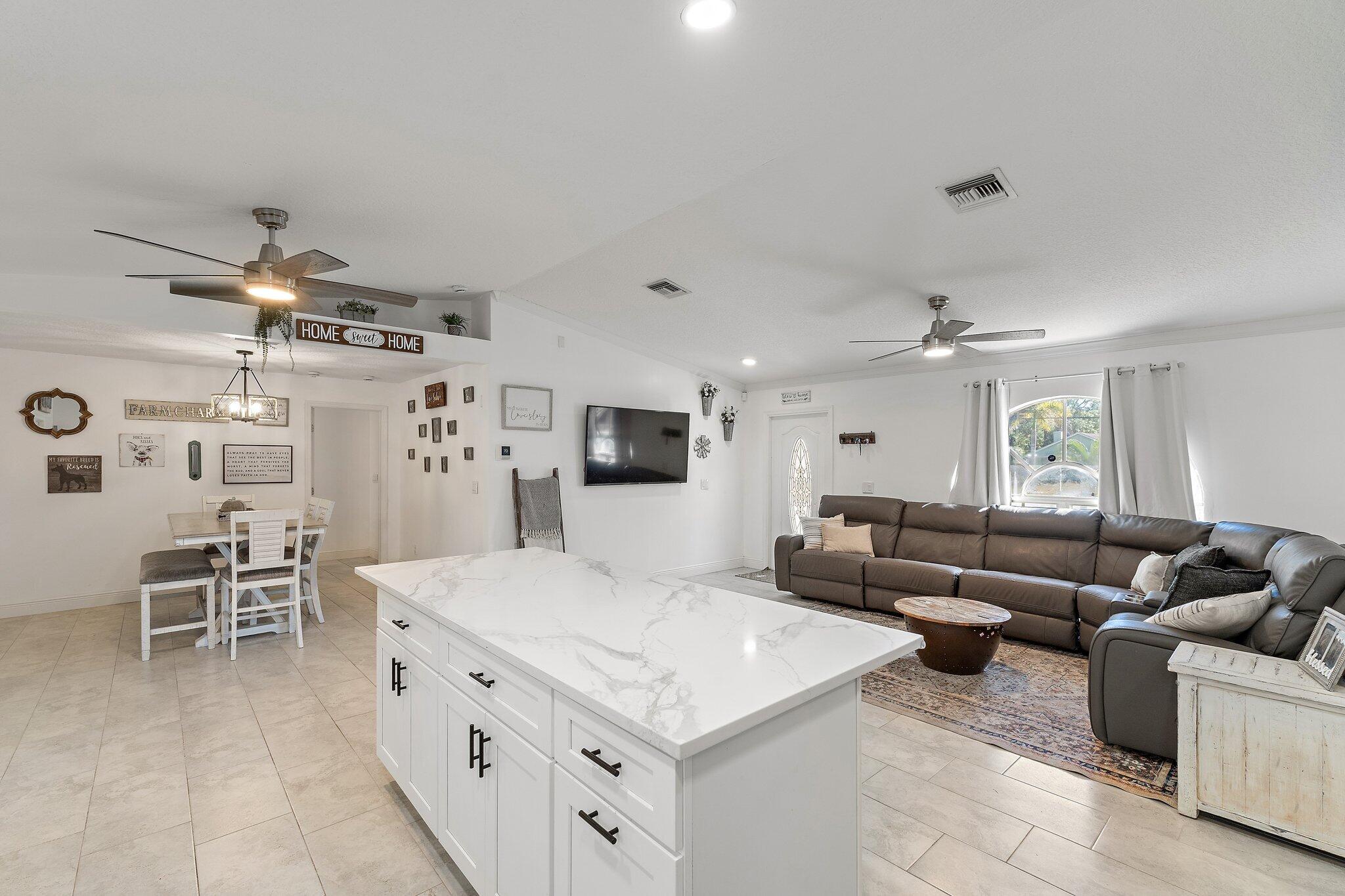 18389 41st Road North Loxahatchee, FL 33470 - Photo 11 of 33 a living room with furniture and view of kitchen