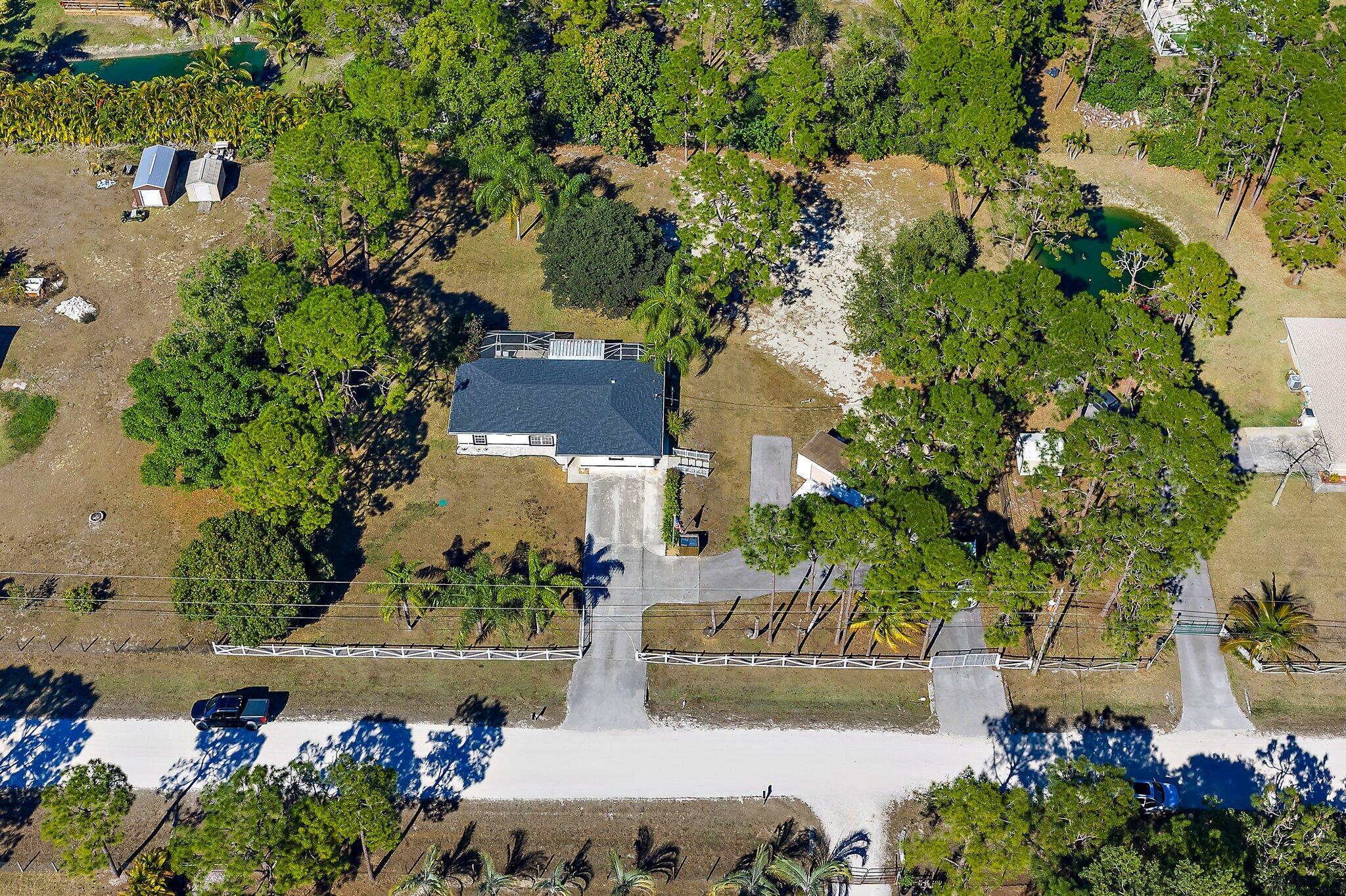 18389 41st Road North Loxahatchee, FL 33470 - Photo 2 of 33 an aerial view of a house with a yard
