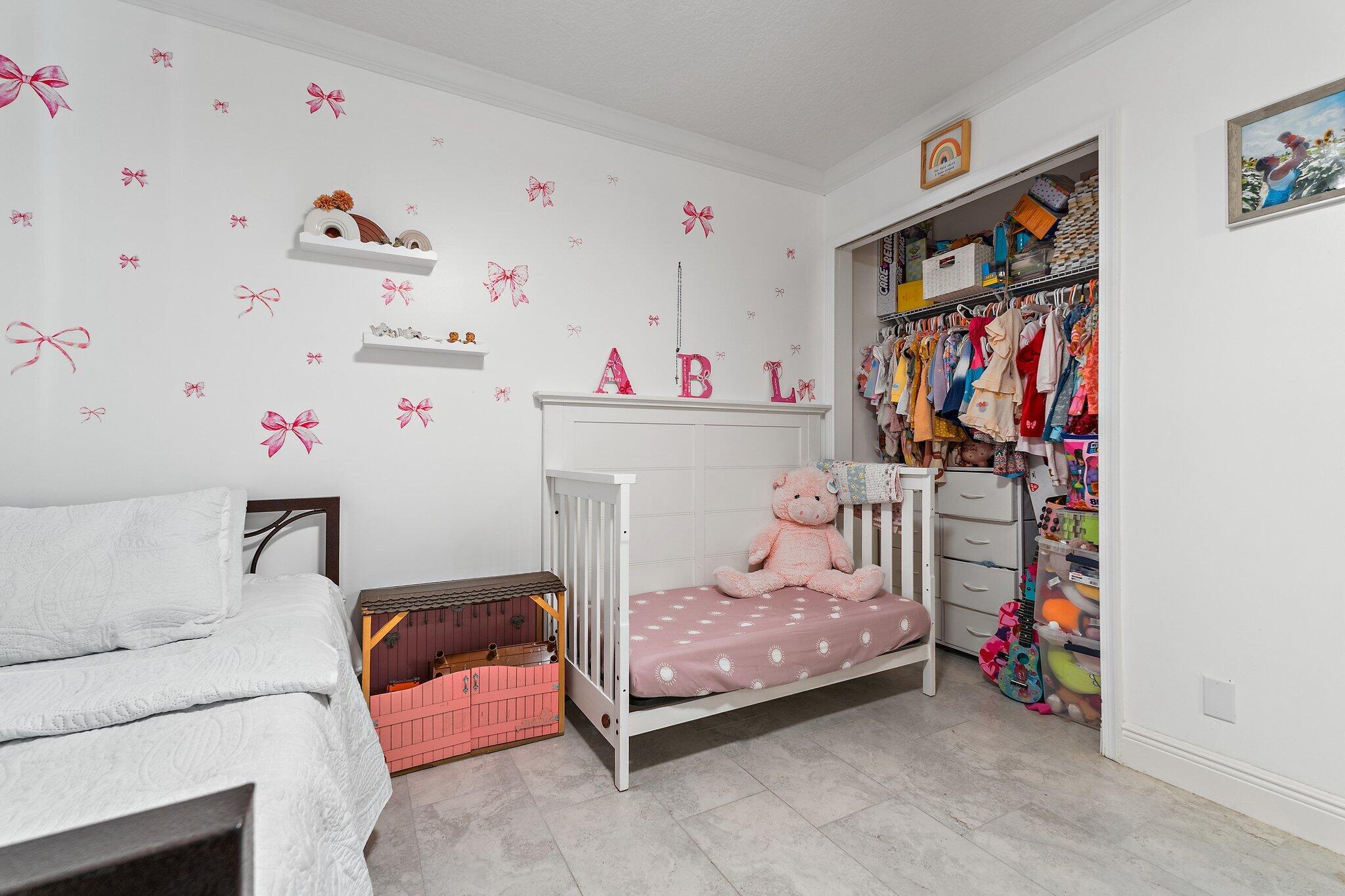 18389 41st Road North Loxahatchee, FL 33470 - Photo 23 of 33 a bedroom with a bed and a window