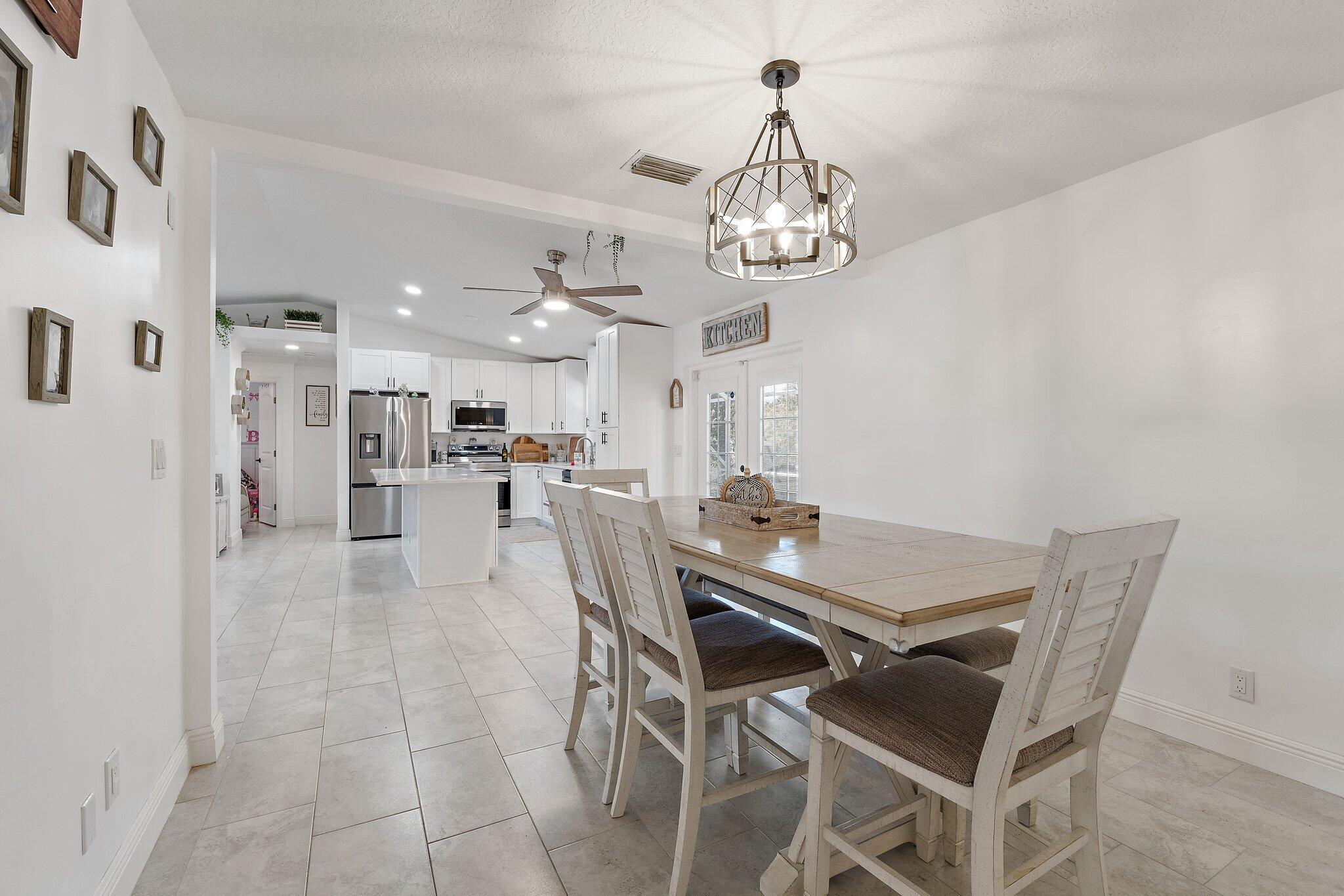 18389 41st Road North Loxahatchee, FL 33470 - Photo 8 of 33 a view of a dining room with furniture