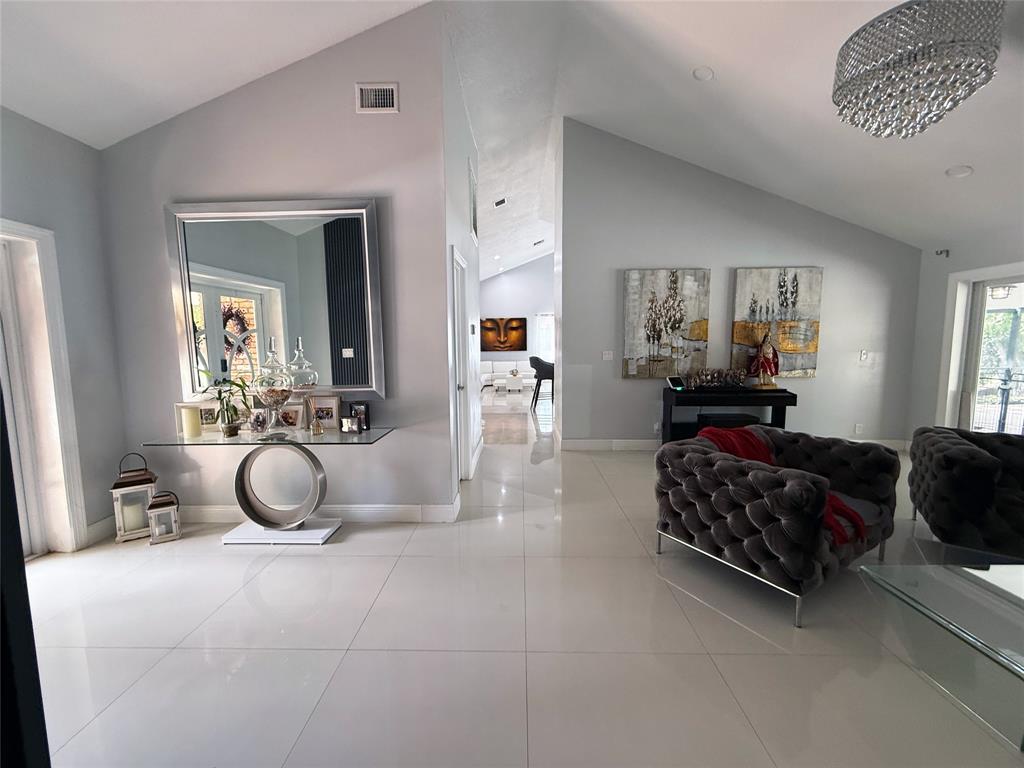 6530 Southwest 172nd Avenue Southwest Ranches, FL 33331 - Photo 11 of 42 a living room with furniture gym equipment and a mirror