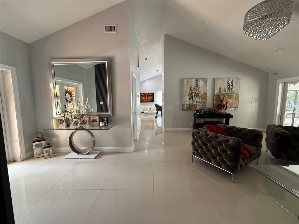 6530 Southwest 172nd Avenue Southwest Ranches, FL 33331 - Photo 13 of 42 a living room with furniture gym equipment and a mirror