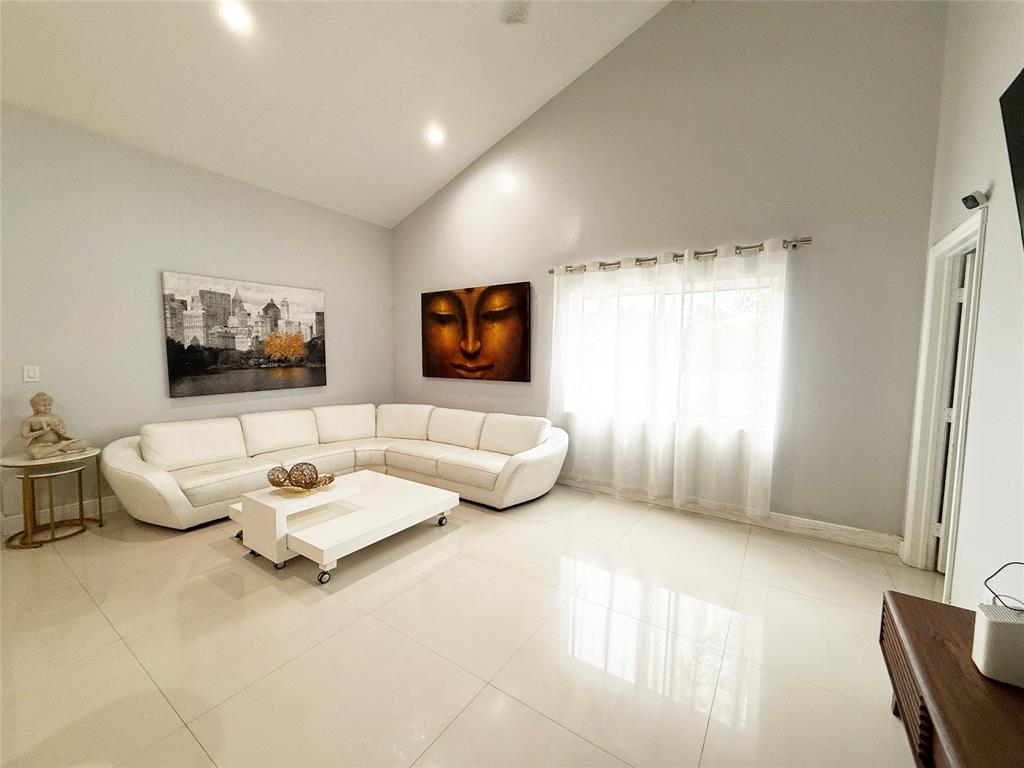 6530 Southwest 172nd Avenue Southwest Ranches, FL 33331 - Photo 14 of 42 a living room with furniture and a flat screen tv