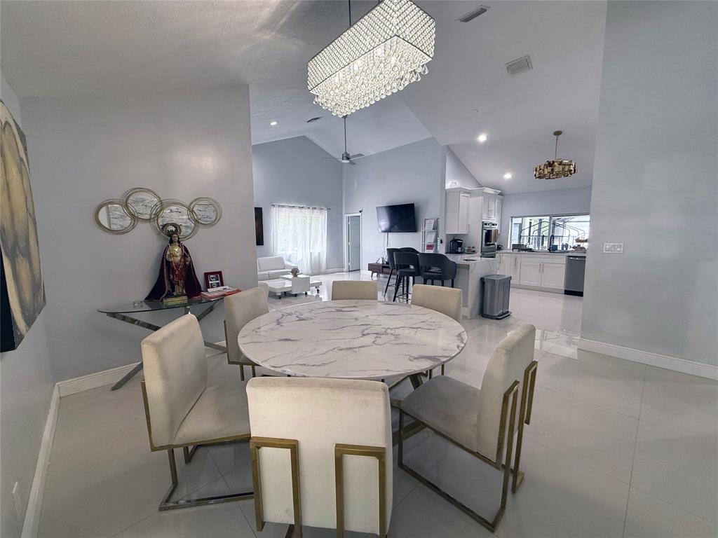 6530 Southwest 172nd Avenue Southwest Ranches, FL 33331 - Photo 16 of 42 a view of kitchen and dining area with furniture