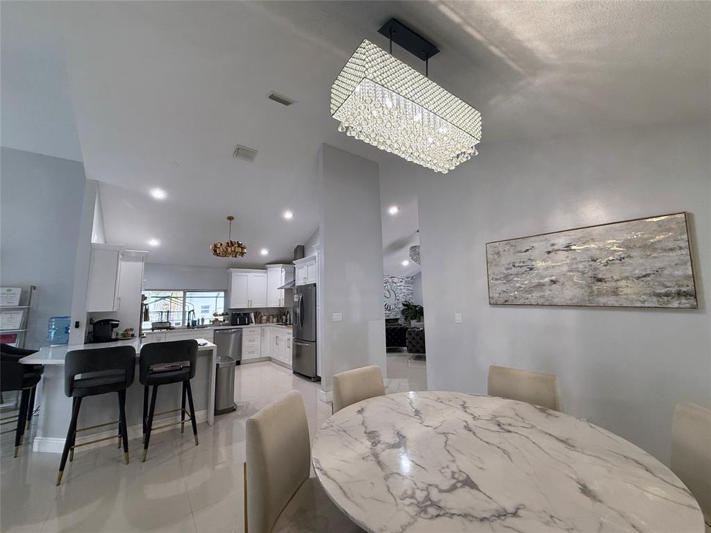 6530 Southwest 172nd Avenue Southwest Ranches, FL 33331 - Photo 17 of 42 a view of a dining room with furniture