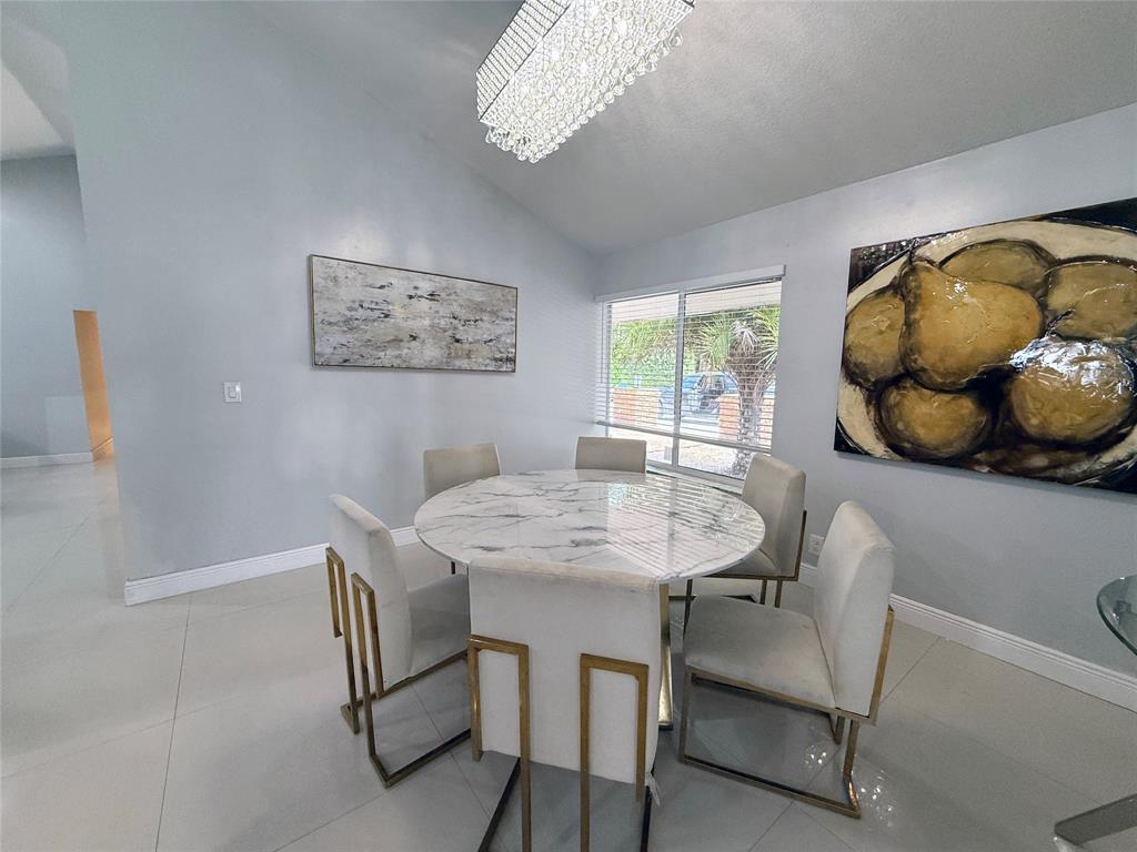 6530 Southwest 172nd Avenue Southwest Ranches, FL 33331 - Photo 18 of 42 a view of a dining room with furniture and window